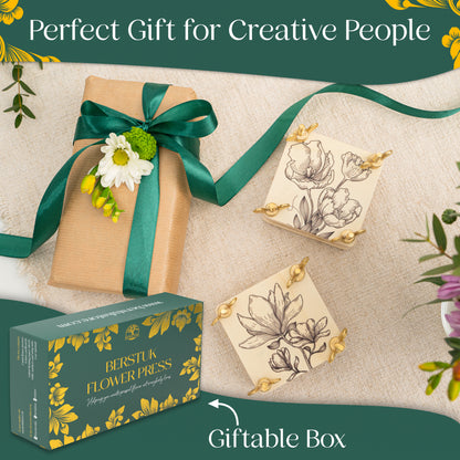 Two wooden mini flower presses next to a box with green ribbon, showcasing giftability of the mini presses 
