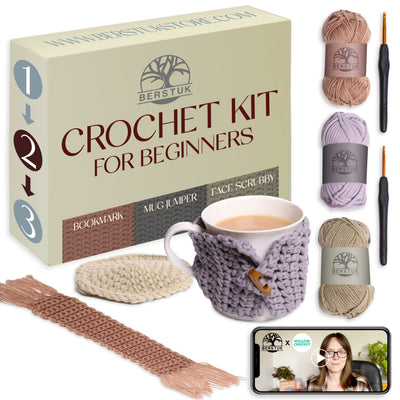 Berstuk crochet kit for beginners with yarn, hooks, and a crocheted mug cozy, face scrub and a bookmark.