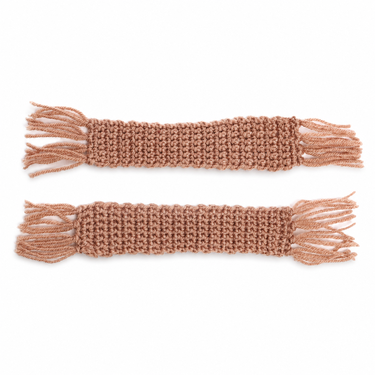 Two matching crochet bookmarks in a dusty brown color, laid flat on a white background with fringe tassels on both ends.