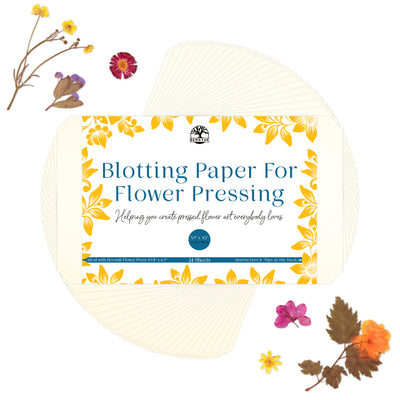 Pack of blotting paper for flower pressing with a floral pattern on the packaging, displayed alongside decorative flowers.