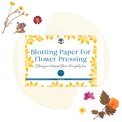 Pack of blotting paper for flower pressing with a floral pattern on the packaging, displayed alongside decorative flowers.